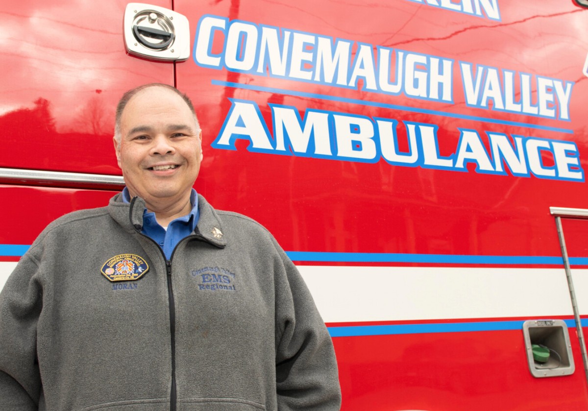 Tony Moran standing in from of the Conemaugh Valley ambulance
