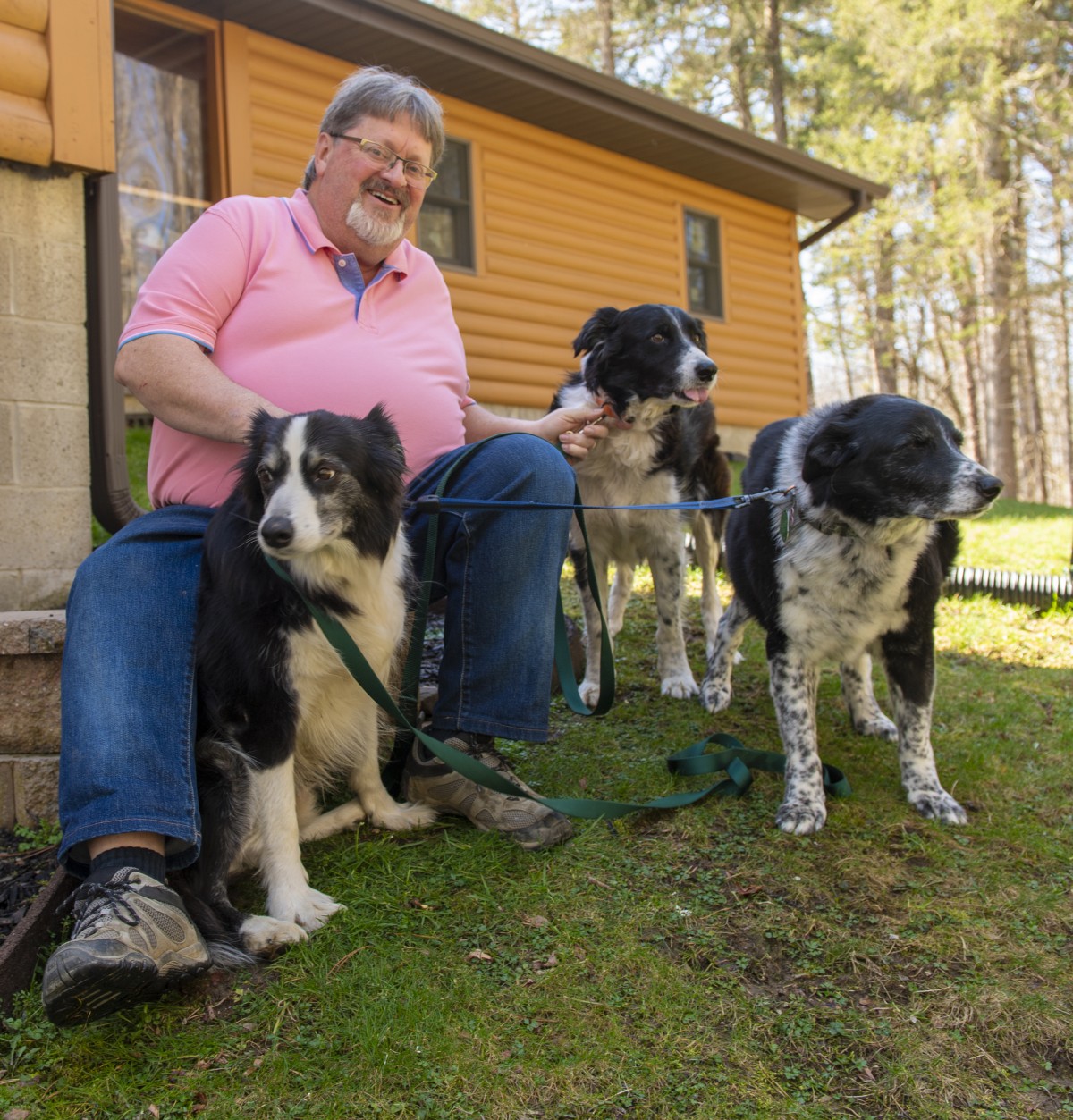 Steve Brant and his three border collies.